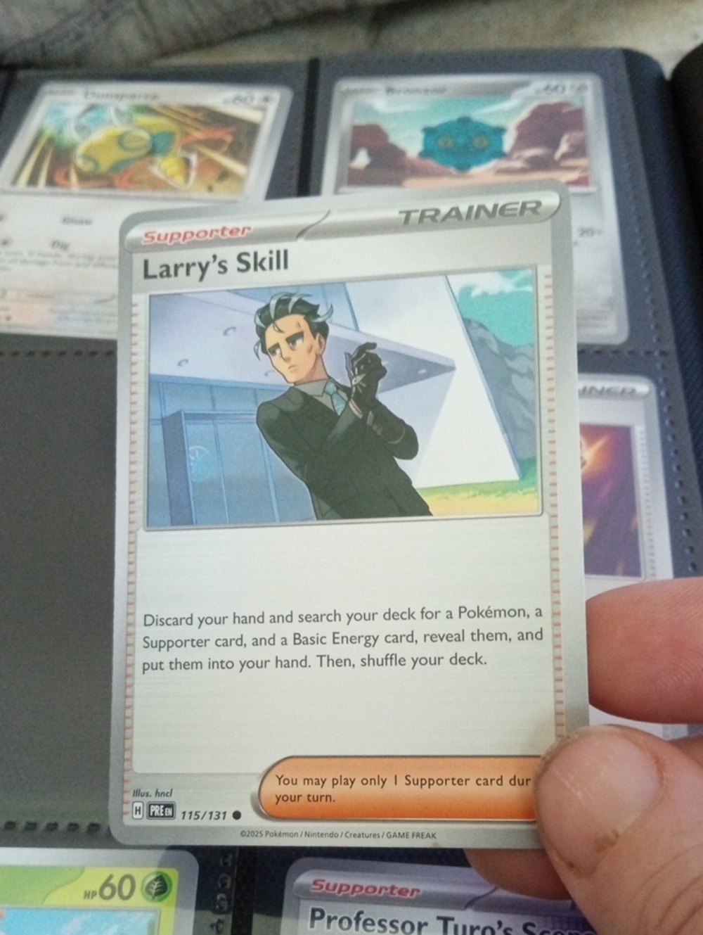 Pokemon Larry’s Skill Trainer Card - White, Green, Blue